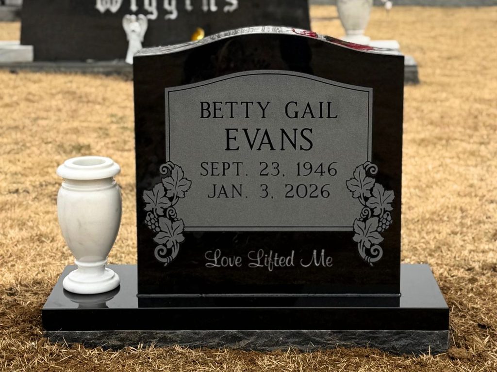 Jet Black single upright granite monument with vase installed by Rico Monuments
