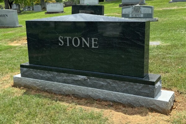 Family estate monument in American Black and Georgia Grey granite featuring an apex top design with a multi-level base, created for a lasting family legacy. Family estate monument in American Black and Georgia Grey granite featuring an apex top design with a multi-level base, created for a lasting family legacy.