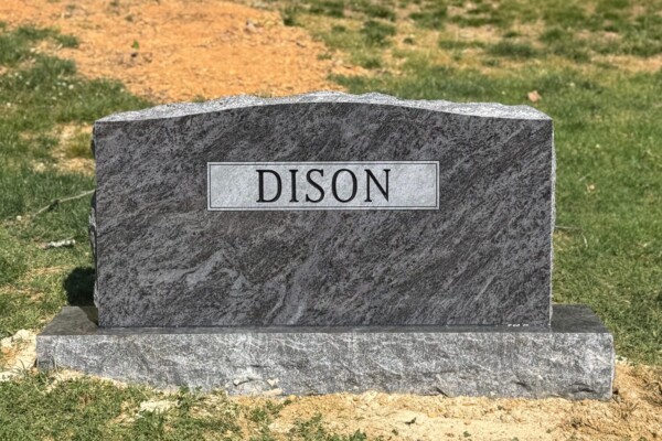 Family monument in Bahama Blue granite with a serpentine top. Family monument in Bahama Blue granite with a serpentine top.