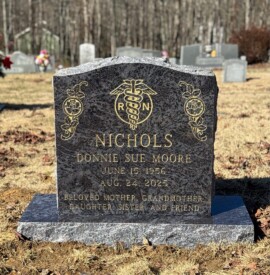 Bahama Blue granite single upright monument with a serpentine top. Bahama Blue granite single upright monument with a serpentine top.