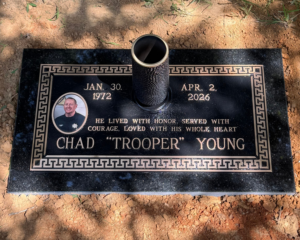 Bronze memorial featuring a classic design, mounted on a Gold Star Black granite base.
