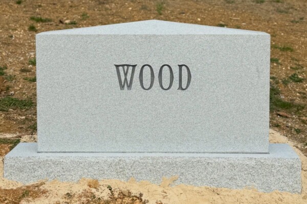 Family monument in Georgia Grey granite featuring an apex top with a fully steeled finish. Family monument in Georgia Grey granite featuring an apex top with a fully steeled finish.