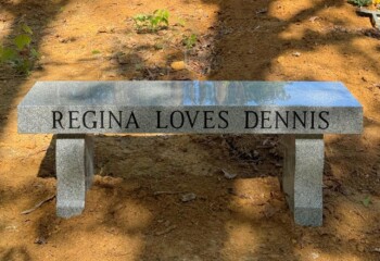 Memorial bench in Georgia Grey granite featuring a straight seat with harp bench legs. Memorial bench in Georgia Grey granite featuring a straight seat with harp bench legs.