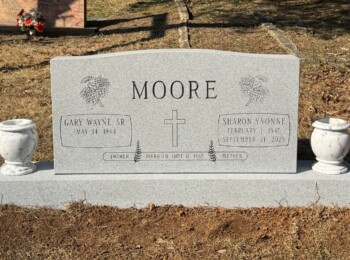 Georgia Grey granite companion upright monument with a fully steeled finish and two white marble vases. Georgia Grey granite companion upright monument with a fully steeled finish and two white marble vases.