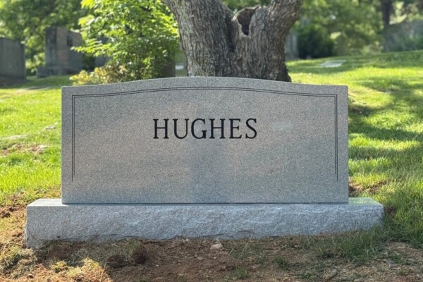 Family monument in Georgia Grey granite with a serpentine top. Family monument in Georgia Grey granite with a serpentine top.