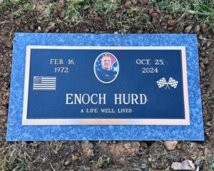 Bronze memorial featuring a polished bevel design, mounted on a Blue Pearl granite base.