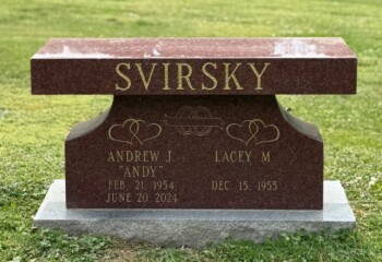 Memorial bench in India Red granite featuring a straight seat with pedestal support. Memorial bench in India Red granite featuring a straight seat with pedestal support.