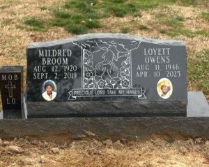 Jet Black granite slant headstone with a polished back, matching base, and tapered vase. Jet Black granite slant headstone with a polished back, matching base, and tapered vase.