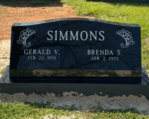 Jet Black granite slant marker with a serpentine top and matching base. Jet Black granite slant marker with a serpentine top and matching base.