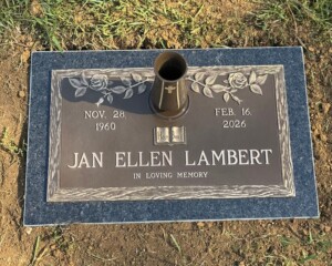 Bronze memorial featuring a rose design, mounted on a Mesabi Black granite base.