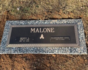 Bronze memorial featuring a classic design, mounted on a Rockville (Moonlight Grey) granite base.