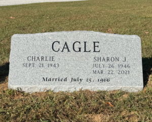Georgia Grey granite slant marker with a serpentine top and polished face. Georgia Grey granite slant marker with a serpentine top and polished face.